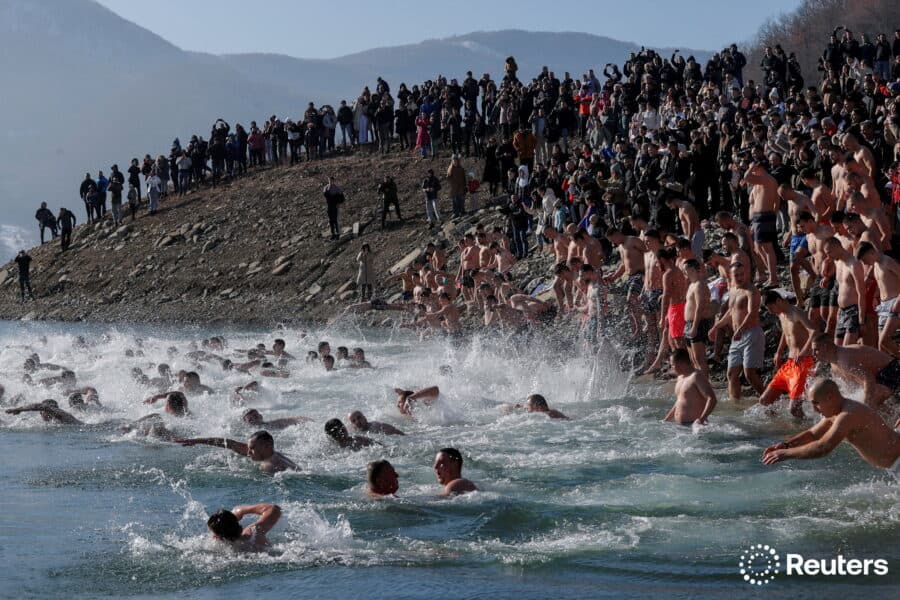 Kosovo ethnic Serbs take part in the traditional Epiphany swimming competition in the lake of Gazivoda, Kosovo